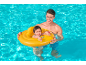 Smiling father and baby in a pool, the baby in a yellow swim ring.