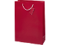 Red gift bag with a blank tag and white handles.