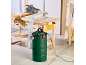 Ash and sawdust vacuum cleaner with a flexible hose and a saw on a workbench.