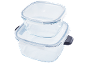 Two stacked glass food containers with clear lids and side clasps.