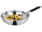 Stainless steel frying pan with chicken, gnocchi, spinach, and red onion.