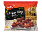 750g Piri Piri chicken wings package with lemon on a plate, with old street background.