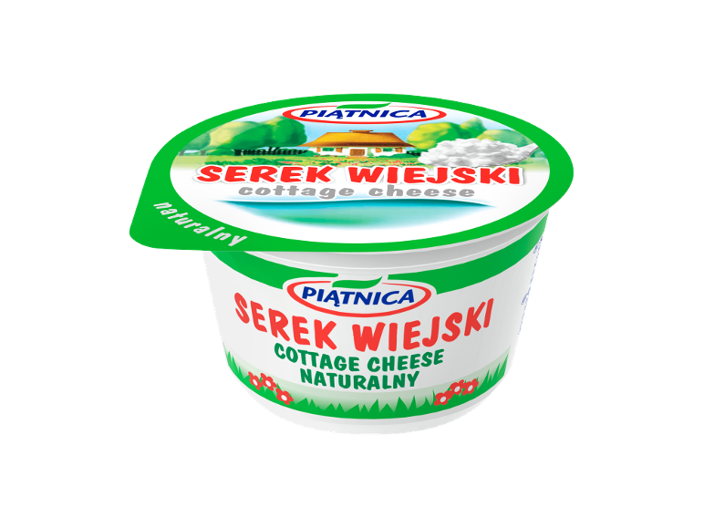 Cottage cheese container with a rural landscape illustration and a spoon of cottage cheese.