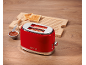 Red toaster with '1973' text, toasted bread, and jam on a wooden table.