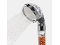 Shower head with filtration, water jets, and visible mineral beads.