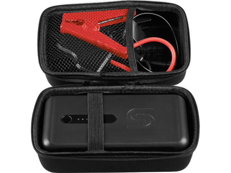 Black portable car jump starter with red clamps and cables in a case.