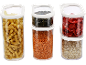 Transparent food containers with pasta, lentils, pumpkin seeds, dried strawberries, and oats.