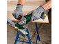 Man cutting metal beam with an angle grinder, sparks flying.