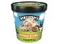 Tub of cookie dough ice cream with a cow holding a bowl and spoon.
