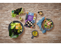 Sushi rice, fish with black rice, and cucumber salad on wood.