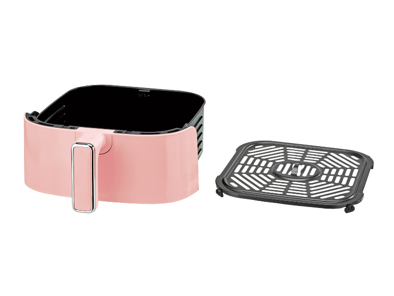 Pink air fryer with a removable black cooking rack on a black background