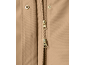 Detail of a beige jacket with a golden zipper and snap buttons.