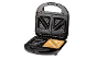 Open black sandwich maker with a toasted sandwich inside