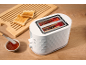 White toaster with toast, jam, and a wooden cutting board.