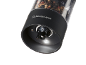 Electric pepper grinder with light, filled with a mix of peppercorns.
