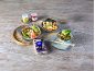 Japanese style sushi rice, ramen, and noodle soup, with ginger jars on a wooden table.