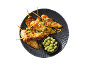 Chicken skewers with sauce, peanuts, and wasabi peas, served on a dark plate.