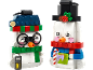 Two toy snowman figures with festive accessories.