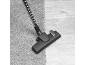 Vacuum cleaner head on carpet and wooden floor, showing versatility.