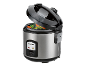 Rice cooker with vegetables steaming inside, lid ajar, on a black background.