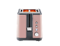 Pink two-slice toaster with illuminated heating elements, front view.