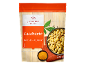 Japanese style peanuts with curry packaging, next to a bowl of peanuts and curry powder.