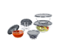 A set of glass food storage bowls with grey lids, some filled with salad, soup, and olives.