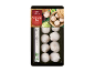 Siao Long Pao meat dumplings in packaging with a bamboo basket and chopsticks.
