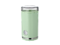 Light green electric coffee grinder with a transparent lid and silver accents