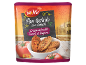 Packaging of crispbreads with tomato and oregano, with a bowl and fresh tomatoes.