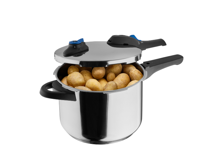 Metal pressure cooker with potatoes inside