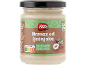 Hazelnut spread with chopped hazelnuts in a glass jar.