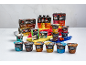 Assortment of high-protein puddings, yogurts, and soft cheese in various flavors.