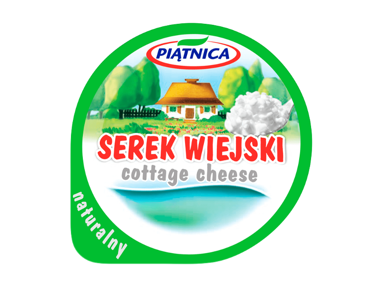 Cottage cheese packaging with a rural scene and a spoon of cottage cheese, with text 'Serek Wiejski' and 'cottage cheese'.