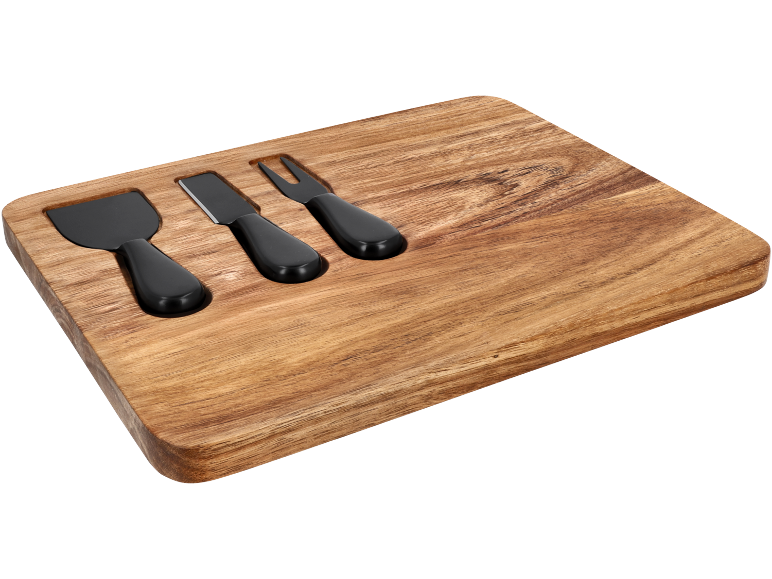 Wooden cheese board with three black-handled cheese knives.