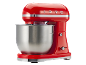 Red stand mixer with a stainless steel bowl and '1973' embossed on top.