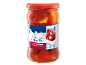 Glass jar of red chili peppers stuffed with soft cheese, Greek style