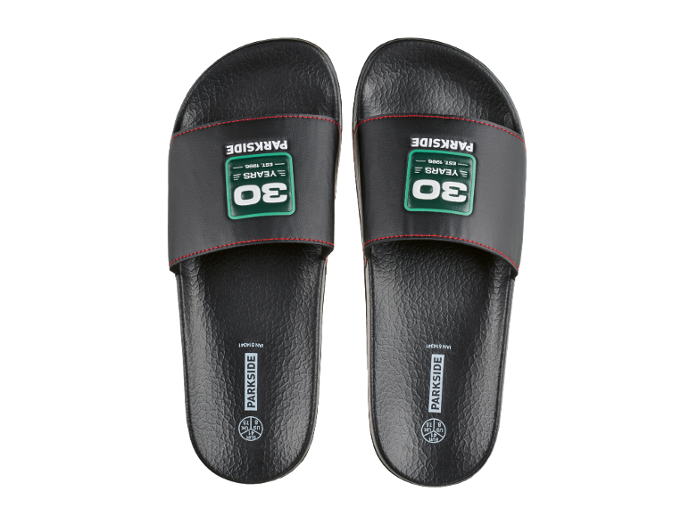 Black slides with red stitching and the inscription «30 YEARS EST. 1996».