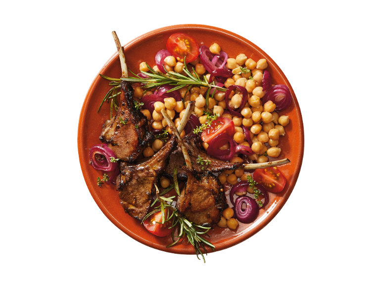 Grilled lamb chops with chickpeas, red onion, cherry tomatoes, and rosemary.
