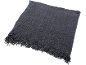 Dark grey throw blanket with fringes, made of ribbed fabric.