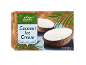 Thai-style coconut ice cream in two coconut halves, with palm leaves.
