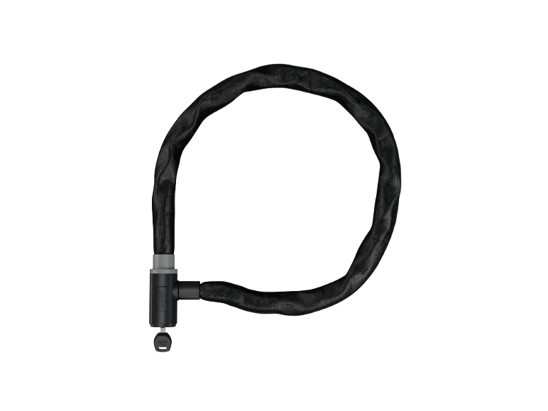 Black bicycle chain lock with a key on a black background.