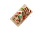 Chocolate cake with raspberries and mint on a rectangular plate.