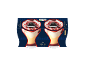 Two zabaglione desserts with cherries in glasses, on a dark blue background with ornaments.