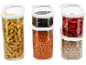 Storage containers with pasta, lentils, pumpkin seeds, dried strawberries, and oats.