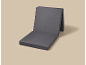 Dark gray foldable seat cushion on a beige background.