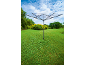 Garden rotary clothesline on a green lawn under a blue sky.