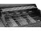 Interior of a gas barbecue with grates and flame tamers.
