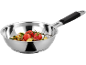 Stainless steel frying pan with roasted vegetables, including tomatoes and zucchini.
