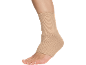 Beige compression ankle brace on a leg